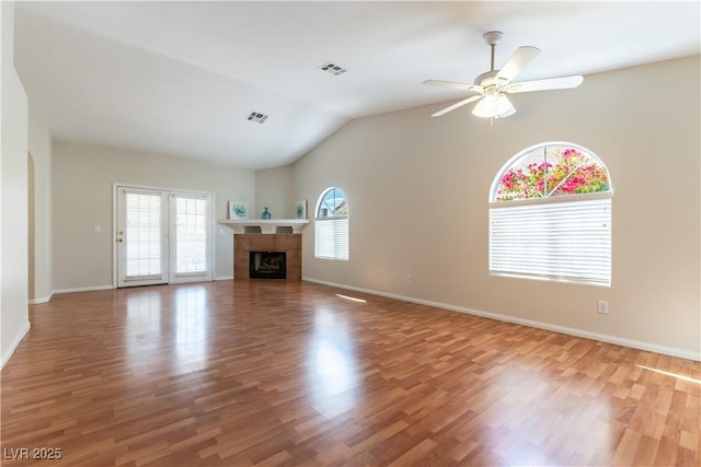 3510 Judah Way, Las Vegas, NV 89147 - unfurnished living room featuring ceiling fan, visible vents, a tiled fireplace, wood finished floors, and baseboards