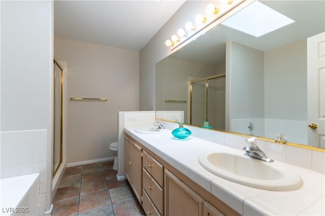 3510 Judah Way, Las Vegas, NV 89147 - bathroom with double vanity, a skylight, a sink, and a stall shower