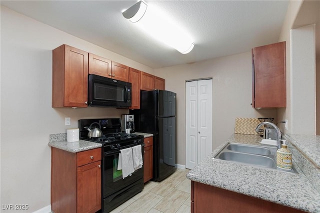2120 Ramrod Ave Unit 513, Henderson, NV 89014 - kitchen with black appliances, a sink, baseboards, and brown cabinets