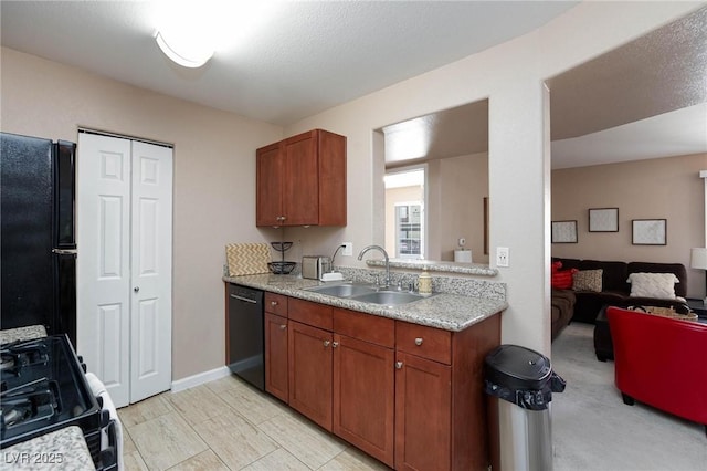 2120 Ramrod Ave Unit 513, Henderson, NV 89014 - kitchen featuring black appliances, a sink, brown cabinetry, and open floor plan