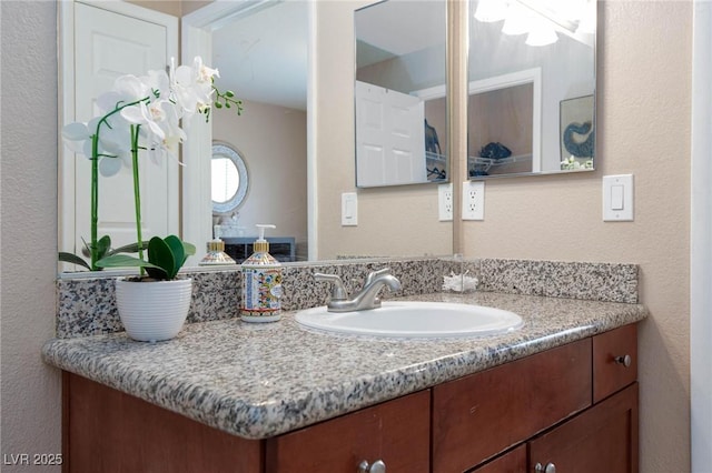 2120 Ramrod Ave Unit 513, Henderson, NV 89014 - bathroom featuring vanity and a textured wall