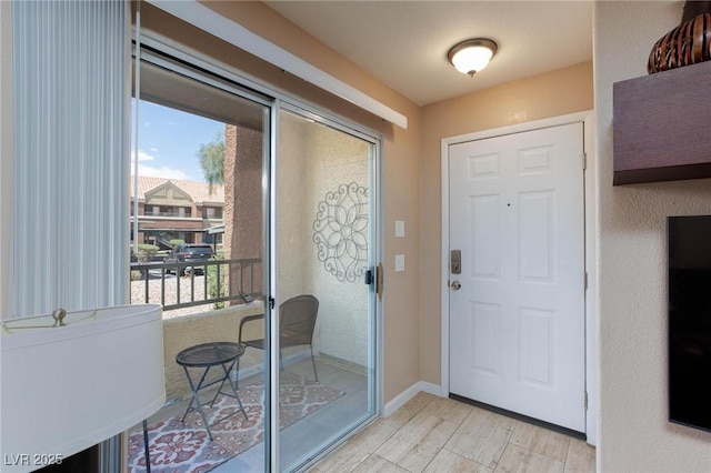2120 Ramrod Ave Unit 513, Henderson, NV 89014 - foyer entrance featuring light wood-style floors and baseboards