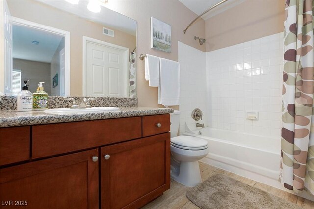 2120 Ramrod Ave Unit 513, Henderson, NV 89014 - bathroom featuring toilet, shower / bath combination with curtain, and vanity
