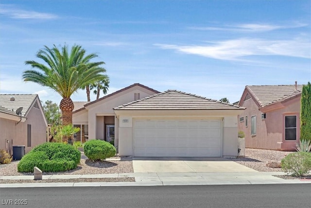 1991 High Mesa Dr, Henderson, NV 89012 - single story home featuring driveway, a tile roof, central AC unit, an attached garage, and stucco siding
