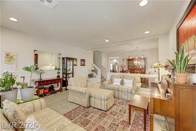 tiled living area with recessed lighting, visible vents, a chandelier, and stairway