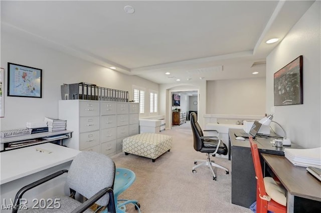 office with recessed lighting and light carpet
