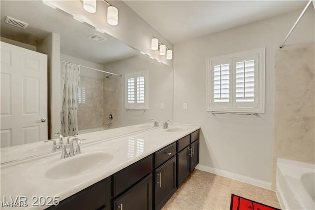 bathroom featuring a sink, tile patterned floors, and visible vents