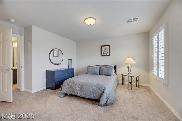 carpeted bedroom with baseboards, visible vents, and multiple windows