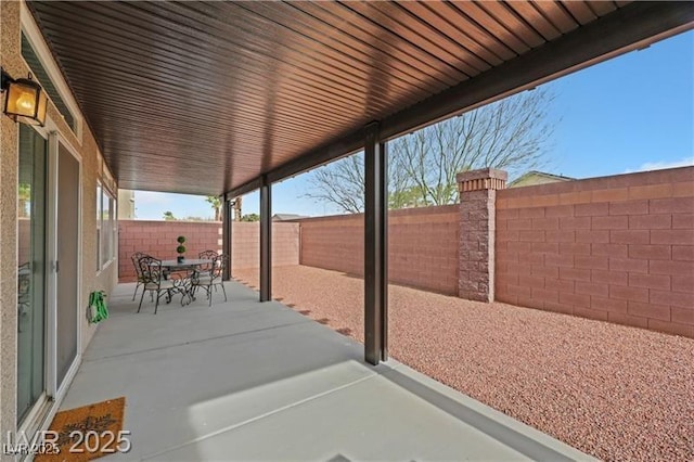 view of patio / terrace featuring a fenced backyard and outdoor dining space