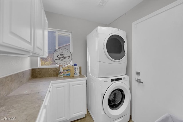204 Appian Way, Henderson, NV 89002 - clothes washing area featuring stacked washing maching and dryer, cabinet space, and visible vents