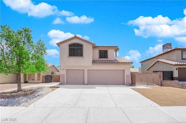 204 Appian Way, Henderson, NV 89002 - mediterranean / spanish home featuring a garage, stucco siding, a gate, concrete driveway, and a tiled roof