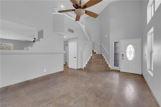 204 Appian Way, Henderson, NV 89002 - foyer entrance with visible vents, a towering ceiling, ceiling fan, and baseboards