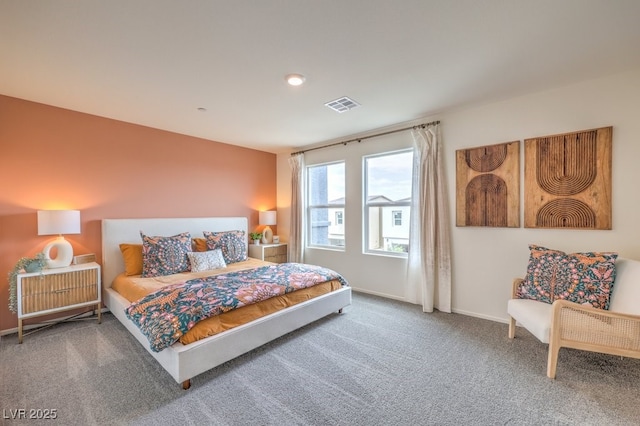 bedroom with visible vents and carpet