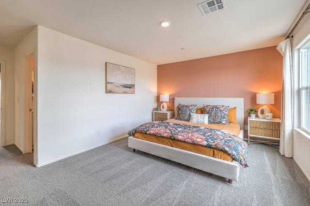 carpeted bedroom featuring baseboards, recessed lighting, and visible vents