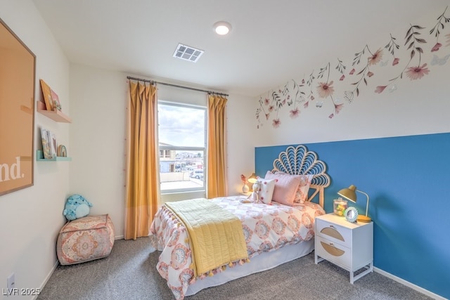 carpeted bedroom featuring baseboards and visible vents
