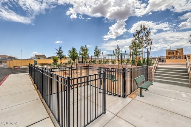 view of home's community with fence