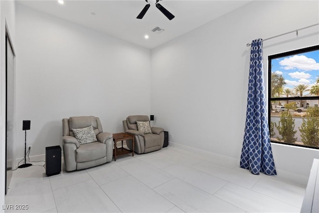 sitting room featuring a ceiling fan, visible vents, a wealth of natural light, and recessed lighting