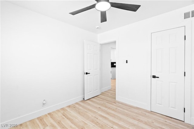 1020 Baker Ave, Las Vegas, NV 89108 - unfurnished bedroom featuring baseboards, a ceiling fan, light wood-type flooring, and visible vents