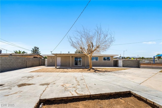 1020 Baker Ave, Las Vegas, NV 89108 - view of front of home with a patio, fence, and stucco siding