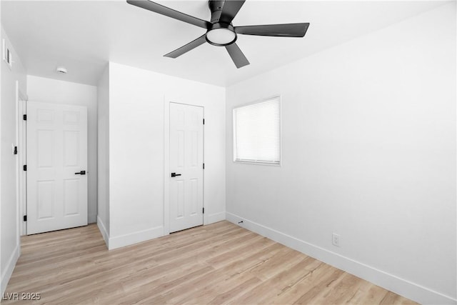 1020 Baker Ave, Las Vegas, NV 89108 - unfurnished bedroom with baseboards, a ceiling fan, light wood finished floors, and visible vents