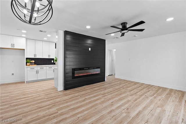 1020 Baker Ave, Las Vegas, NV 89108 - unfurnished living room featuring visible vents, recessed lighting, and light wood-style floors
