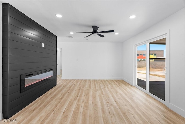 1020 Baker Ave, Las Vegas, NV 89108 - unfurnished living room featuring light wood-style floors, a large fireplace, recessed lighting, baseboards, and visible vents