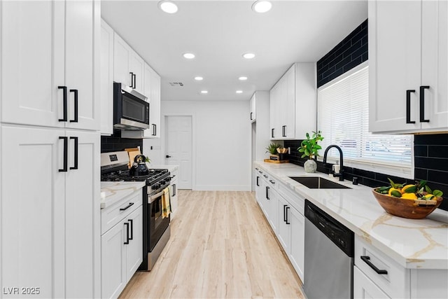 1020 Baker Ave, Las Vegas, NV 89108 - kitchen featuring recessed lighting, a sink, appliances with stainless steel finishes, and backsplash