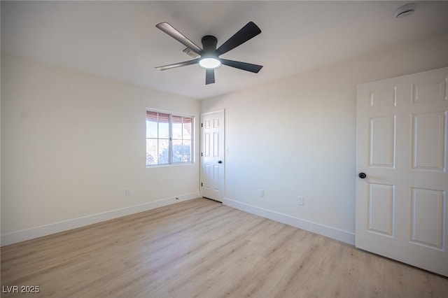 unfurnished bedroom with baseboards, ceiling fan, wood finished floors, and a closet