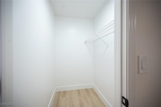 spacious closet with light wood-style floors