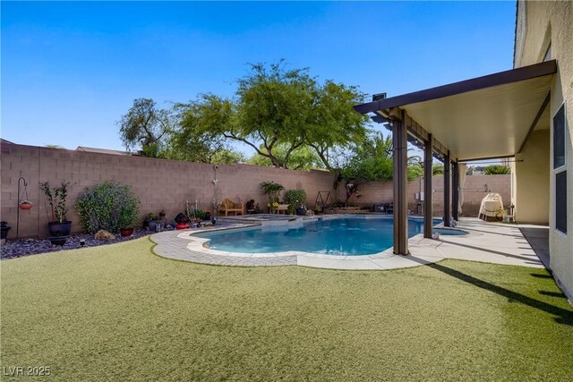 view of swimming pool featuring a fenced in pool, a fenced backyard, and a patio