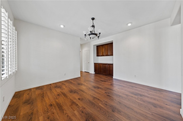 4217 Box Canyon Falls Ave, North Las Vegas, NV 89085 - interior space with baseboards, recessed lighting, dark wood-style floors, and a chandelier