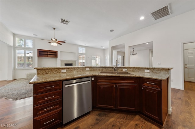 4217 Box Canyon Falls Ave, North Las Vegas, NV 89085 - kitchen with stainless steel dishwasher, open floor plan, visible vents, and a sink