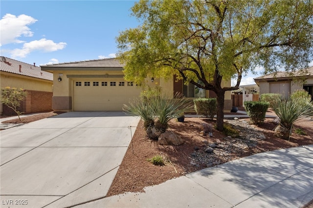 4217 Box Canyon Falls Ave, North Las Vegas, NV 89085 - ranch-style home featuring an attached garage, concrete driveway, and stucco siding