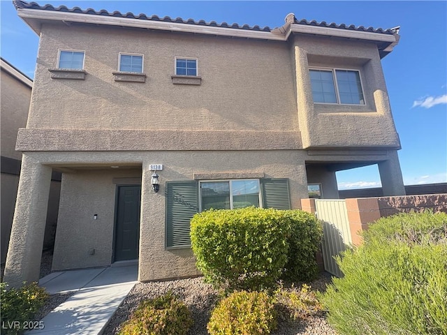 9138 Hermosa Valley St, Las Vegas, NV 89178 - townhome / multi-family property featuring fence and stucco siding