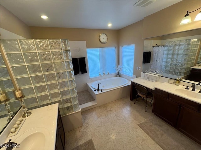 full bath with walk in shower, vanity, recessed lighting, visible vents, and a garden tub