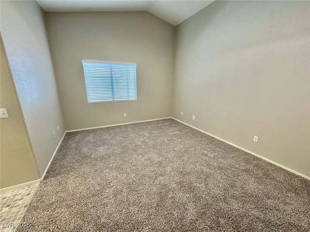 10025 Catseye Cove Ct, Las Vegas, NV 89183 - carpeted spare room featuring baseboards and vaulted ceiling