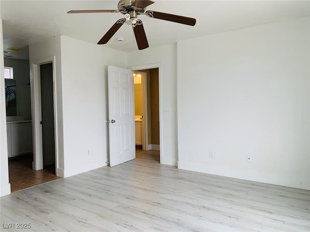 unfurnished bedroom featuring baseboards, ceiling fan, and wood finished floors