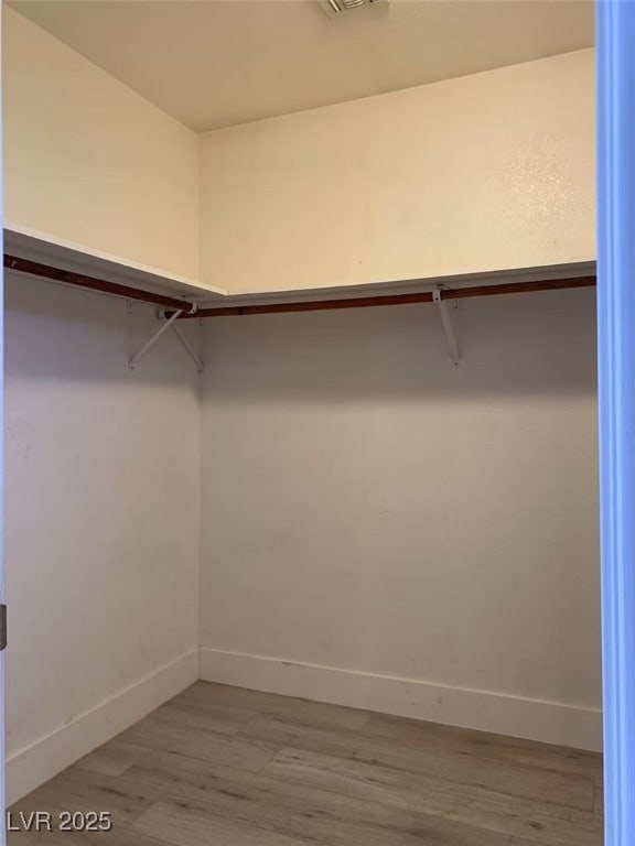walk in closet featuring light wood-type flooring