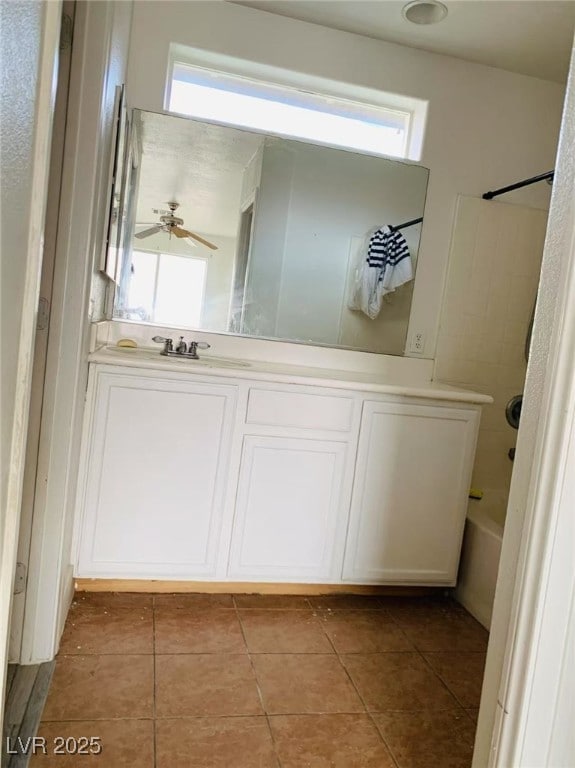full bath featuring vanity, a ceiling fan, shower / bathing tub combination, and tile patterned floors