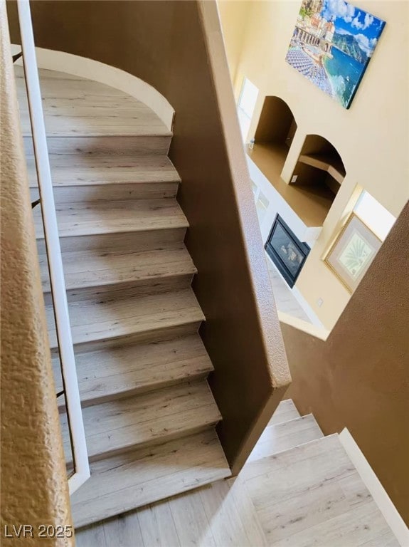 stairs with wood finished floors