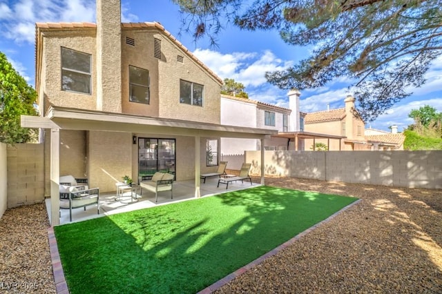 10009 Coral Sands Dr, Las Vegas, NV 89117 - rear view of property featuring fence, a patio, stucco siding, and a tiled roof