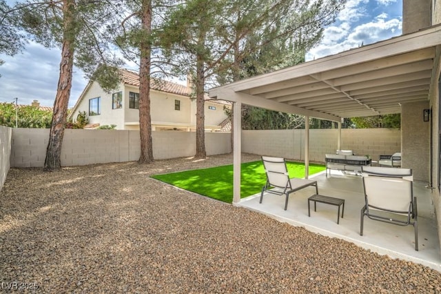 10009 Coral Sands Dr, Las Vegas, NV 89117 - view of yard with a fenced backyard, a patio, and an outdoor living space