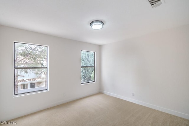 10009 Coral Sands Dr, Las Vegas, NV 89117 - unfurnished room featuring baseboards, light colored carpet, and visible vents