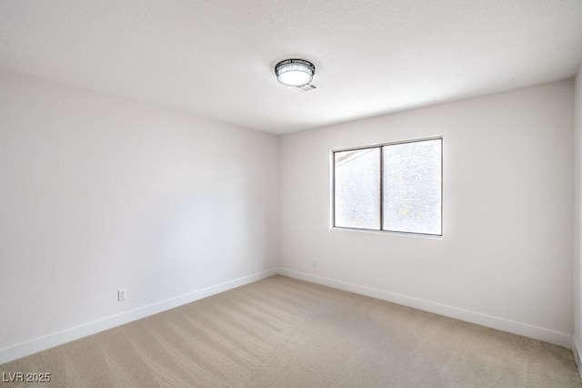 10009 Coral Sands Dr, Las Vegas, NV 89117 - empty room featuring baseboards and light carpet