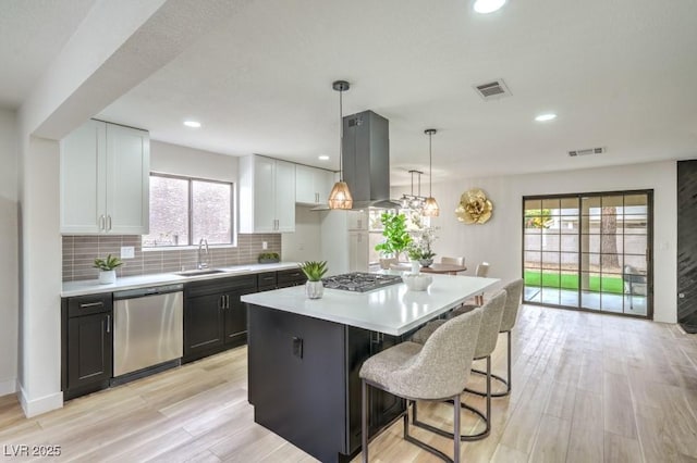 10009 Coral Sands Dr, Las Vegas, NV 89117 - kitchen featuring visible vents, a sink, appliances with stainless steel finishes, and light countertops