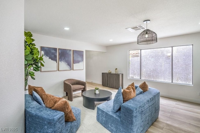 10009 Coral Sands Dr, Las Vegas, NV 89117 - living room with baseboards, recessed lighting, wood finished floors, and visible vents