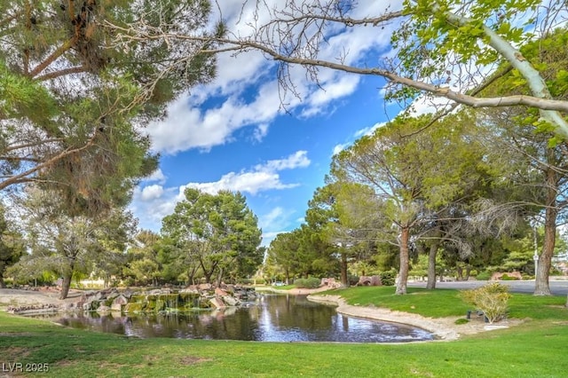 10009 Coral Sands Dr, Las Vegas, NV 89117 - view of property's community featuring a lawn and a water view