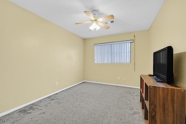 unfurnished living room featuring a ceiling fan, baseboards, and carpet