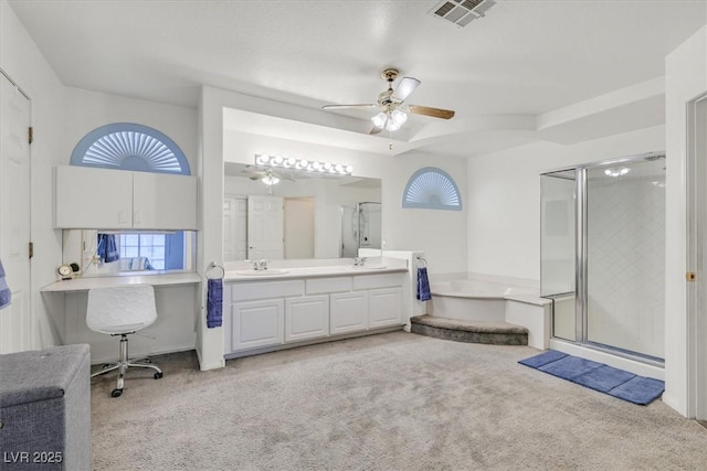 bathroom with visible vents, a ceiling fan, carpet, and a stall shower