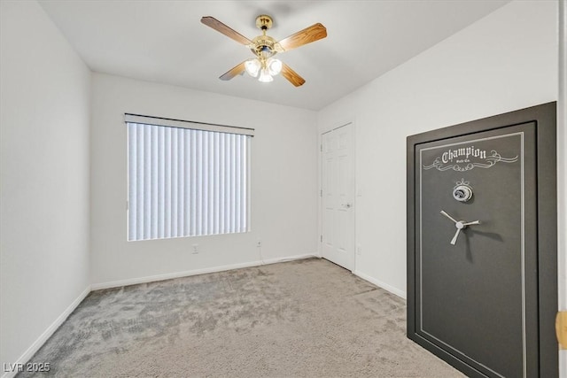unfurnished bedroom featuring baseboards, carpet, and a ceiling fan